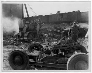 [Military personnel looking at damaged machinery after the 1947 Texas City Disaster]