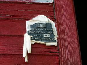 [Plaque on Red Building]