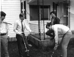 Students playing croquet