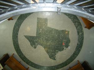 [Seal of Texas on Floor]