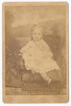 [Unknown Young Girl Seated in Fabric Chair]