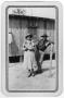 Thumbnail image of item number 1 in: '[Woman and man pose outside a building in a Texas Civilian Conservation Corp camp]'.