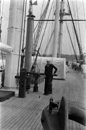 [J. Opre McCoy on the Deck of a Historic Ship]
