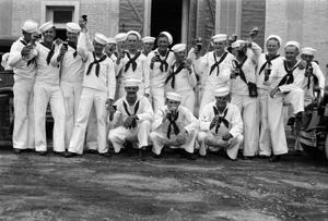 [Group of Sailors Holding Beers]