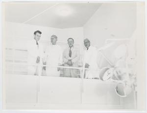 [Dr. Chauncey D. Leake and Three Others in an Operating Room]