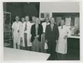 Thumbnail image of item number 1 in: '[Dr. Chauncey D. Leake and Seven Colleagues at a Medical Exhibition]'.