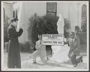 [Men with Catholic Interracial Council Sign]