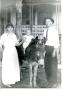 Primary view of [Susie Lee Hyde Man, Percy Mann, and Child on Horseback]