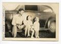 Photograph: [Aubrey Loving, Aron Alexander, and Martha Scott Sitting on a Car Doo…