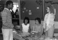 Primary view of Mike Wilson, Beth Kohlmeyer, Regina Placker and Peggy Durant at a bake sale.