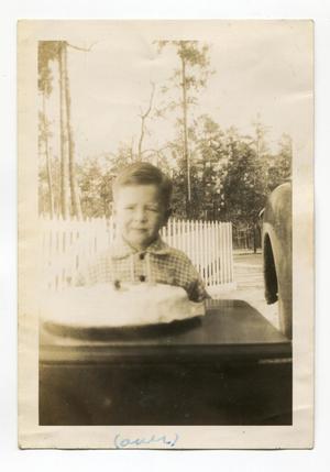 Primary view of object titled '[Aron Alexander With a Birthday Cake]'.