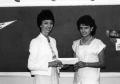 Photograph: [Edna Sides, chairman of the educational skills department, awards Iv…