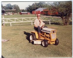 [William Pate on Lawnmower With Grandson at Sunnyhill Ranch]