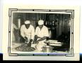 Photograph: [Jephta Brown and Clonie J. White Sugaring Donuts]