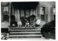 Photograph: [Fuller Family Members Sitting on Front Porch]