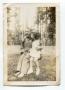 Photograph: [Aron Alexander and Martha Scott Sitting in a Swing]