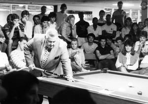 Jack White, pro billiards player demonstrating his technique to students