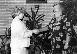 [Dr. Vivian Blevins, left, bids farewll to Bevie Woods who recently conducted a three day audit of the colleges compliance with civil rights regulations.]