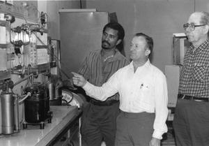 [Air conditioning instructor Bennie Sparkman with Reuben Edwards (from left) and Dave Clark.]