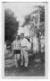Photograph: [Edith Faye Broom Carlton and Royce Guy Carlton Standing Outside]