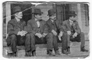 [Seated outside Sikes Belt Co.]