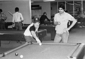 [Two students playing pool in Moler Hall game room.]