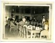 Photograph: [People Sitting in a Mess Hall]