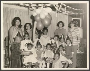 Primary view of object titled '[Adults and Children at a Birthday Party]'.