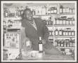 Photograph: [Smiling Man Behind Liquor Store Counter]