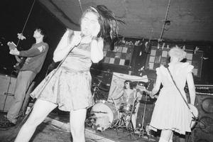 Primary view of object titled '[Bikini Kill Performing at Cavity]'.