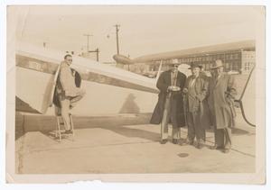 Primary view of object titled '[Four Men with Airplane]'.