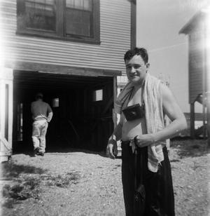 [Man With Camera and Towel Around His Neck]