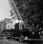 Photograph: [Fire Truck with Ladder Extended]