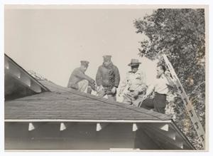 [Four Men on a Roof]