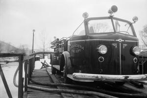 Primary view of object titled '[Pasadena Fire Department Fire Engine on a Bridge]'.