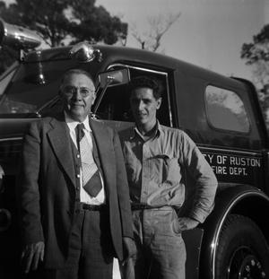 Primary view of object titled '[Two Men in Front of Ruston Fire Department Truck]'.