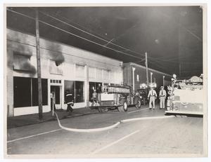 [Fire Engines Outside of Burned Building]