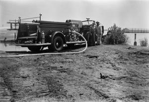 [Two Men with Denton Fire Department Fire Engine]