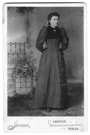 [Unidentified woman posing in dress and bodice]