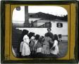 Photograph: Glass Slide of Smiling Woman Surrounded by Young Girls