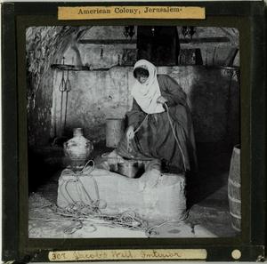 Primary view of object titled 'Glass Slide of Woman Drawing Water at Jacob’s Well (West Bank, Israel)'.