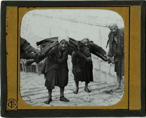 Primary view of object titled 'Glass Slide of Egyptian Water Carriers (Cairo)'.