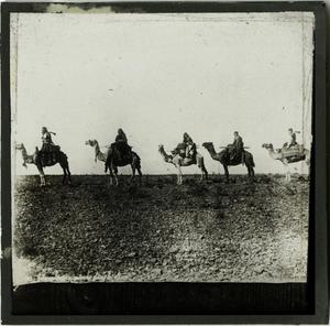 Primary view of object titled 'Glass Slide of Line of Camels and Riders'.