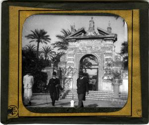 Glass Slide of Men By an Arch with Palm Trees in Background