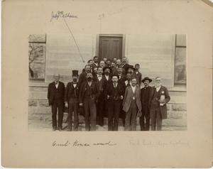 Court-House crowd [Group of Travis County officials standing on the steps of a stone building]