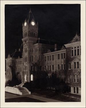 [University of Texas Old Main Building at night]