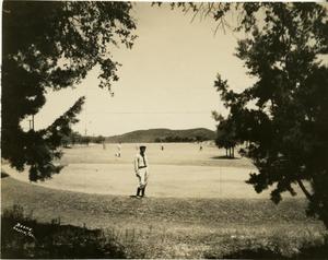 [Golfers on the green at Municipal Golf Course]