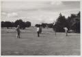 Primary view of [Golfers putting on Municipal Golf Course green]