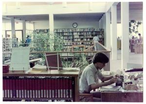 Logan Ragsdale at the Reader's Adviser Desk at the Denton Public Library