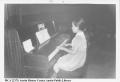 Photograph: [Girl playing piano at Pan American Recreation Center]